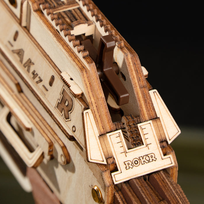 ROKR AK-47 Assault Rifle Toy Gun LQ901 3D wooden puzzle, scale comparison alongside accessories