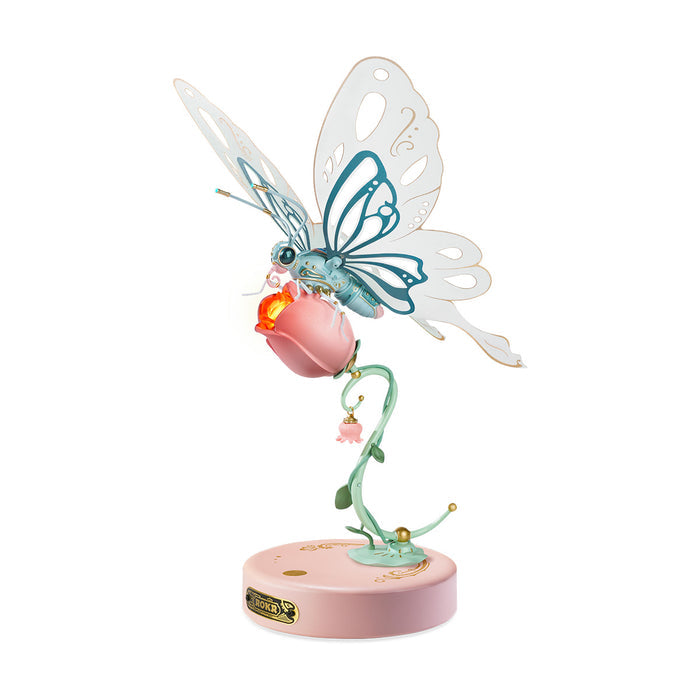 ROKR Butterfly mechanical 3D puzzle assembled in mint green and pink tones, perched on a sculpted rose stem with a