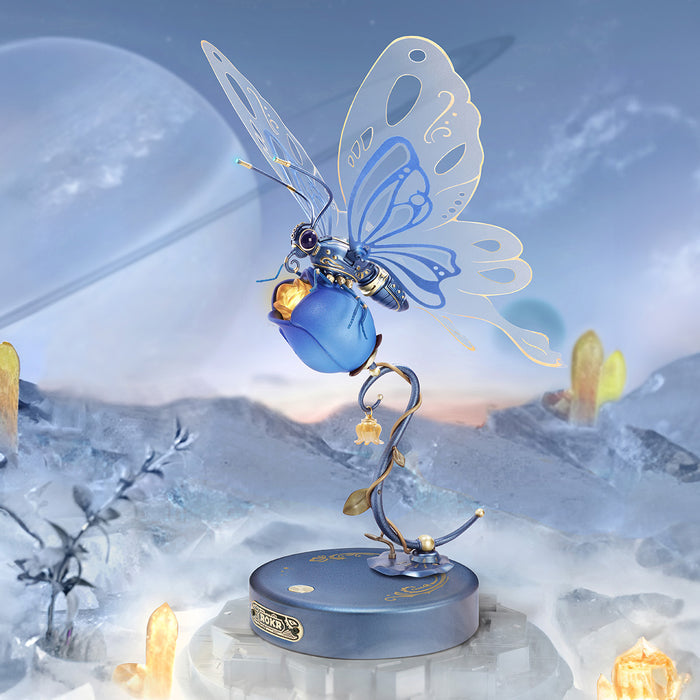 ROKR Butterfly mechanical puzzle in blue and white displayed on a white column against a wintry planet and ice-covered