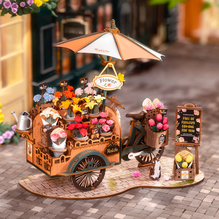 Rolife Blossom Cart assembled with colorful blooms, a watering can, and flower shop signboard on cobblestone base