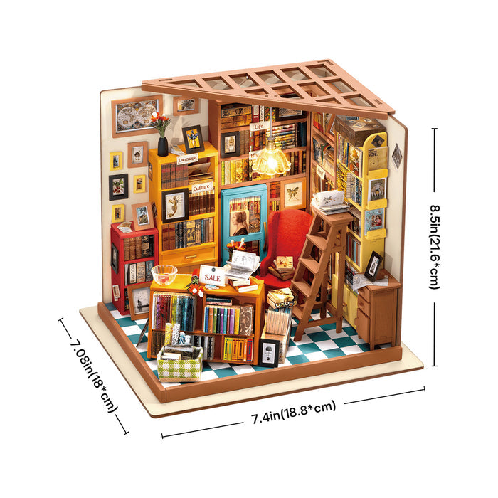 Rolife Sam's Study Library DG102 miniature bookshop front view with warm pendant lamp, colorful stacked books, sale counter and checkered tiled floor on a wooden desk