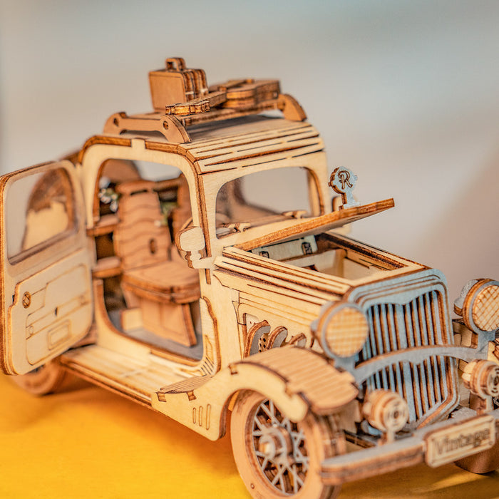 Rolife Vintage Car 3D wooden puzzle TG504 showing assembled classic automobile model in natural wood tone on white background
