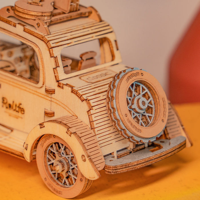 Rolife Vintage Car 3D wooden puzzle TG504 angled rear view showing detailed wooden bodywork, wheels, and chassis construction