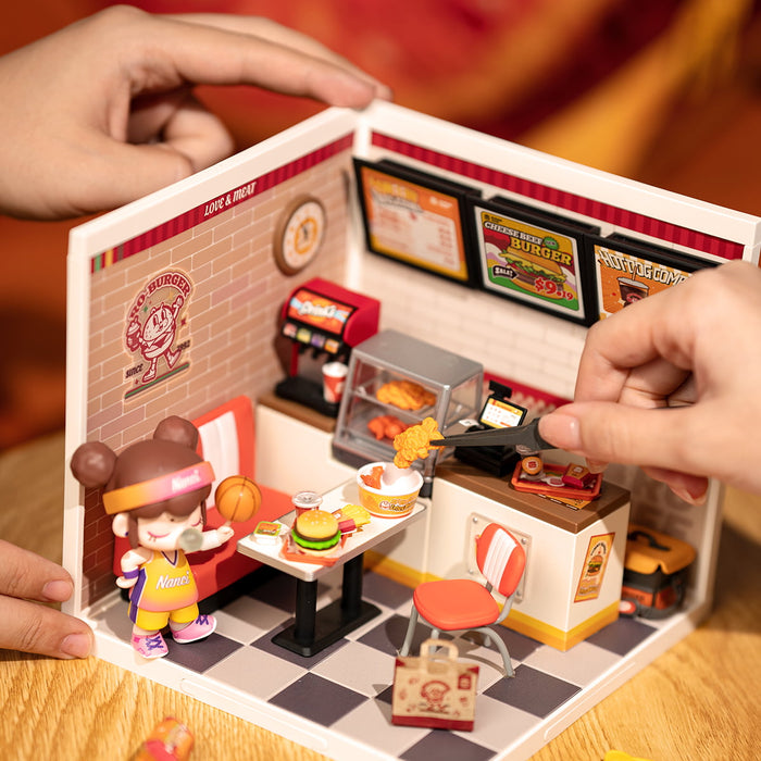 Rolife Yum Yum Burgers DW010 DIY miniature dollhouse kit, angled three-quarter view of the build